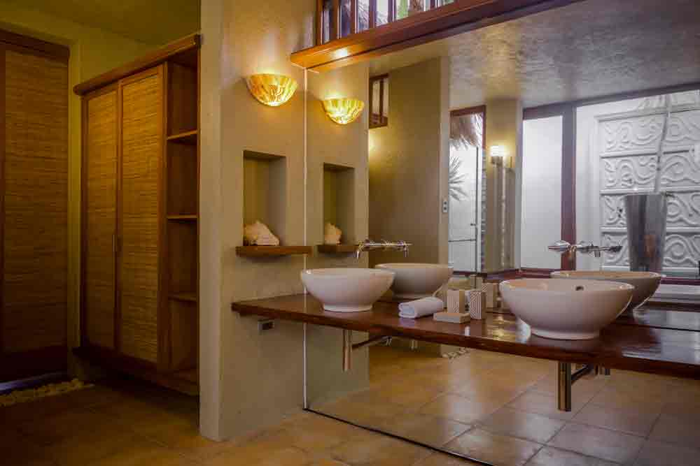 Dim lights add to the ambience of this ultraluxe bathroom.