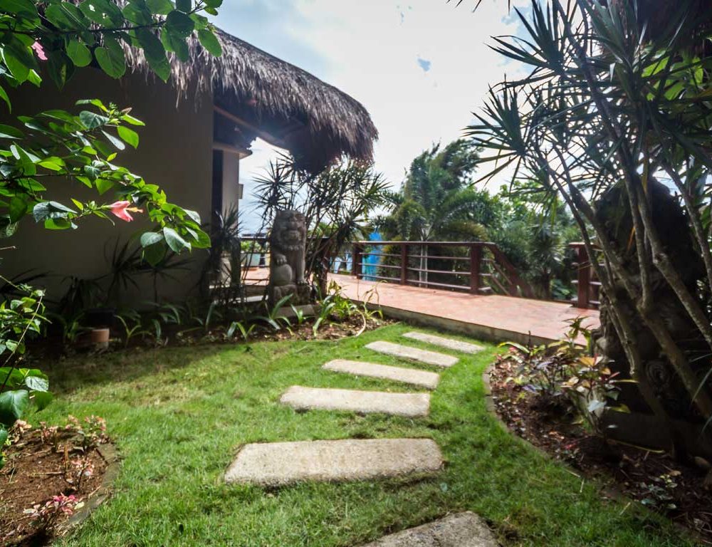 Concrete pathways will lead you to the villa’s tastefully designed structures. The well-maintained lawn and exotic plants are creatively designed by a landscape architect.