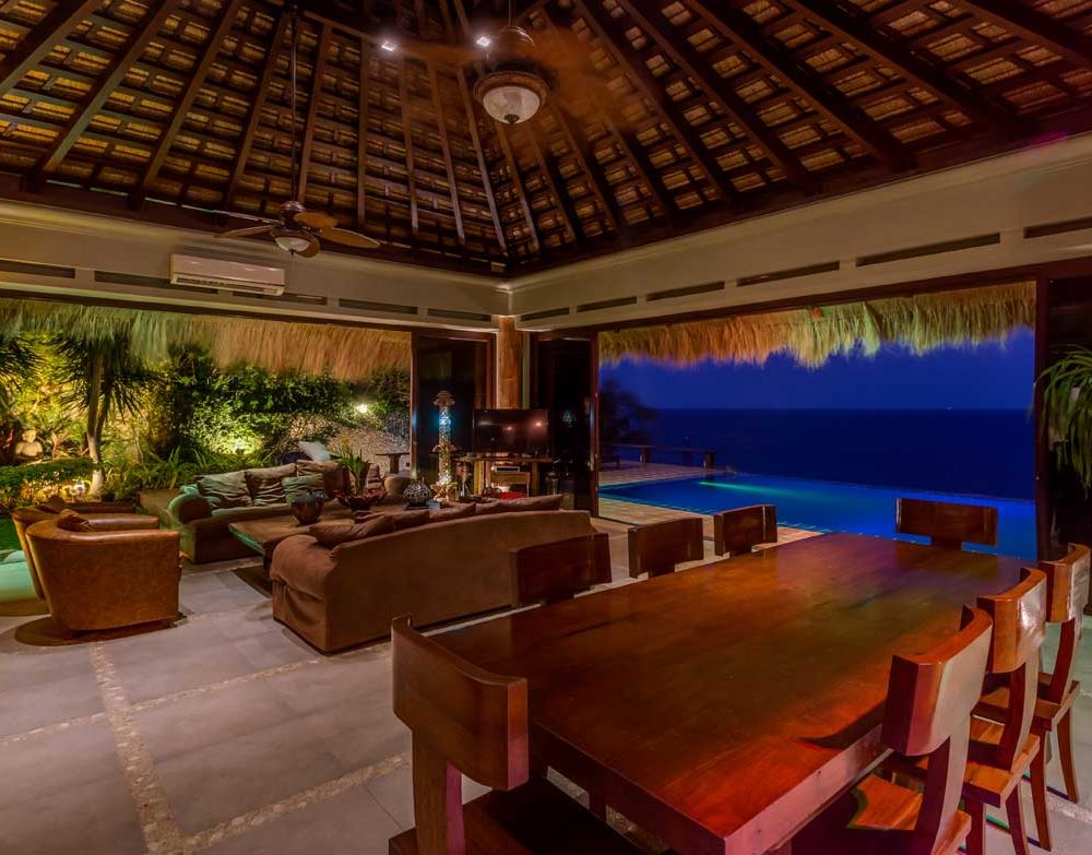 High vaulted ceilings create a real feel of a Balinese vacation house with the infinity pool providing a natural cooling system perfect for a laid-back evening.