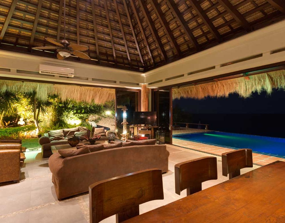 High vaulted ceilings create a real feel of a Balinese vacation house with the infinity pool providing a natural cooling system perfect for a laid-back evening.